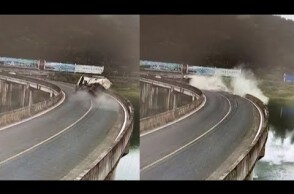 Blown tire causes truck rollover into lake in east China