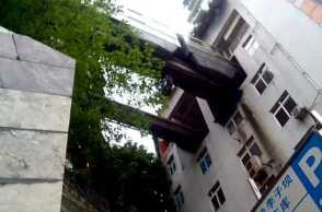 Chongqing, China, Train runs into building's 5th floor.