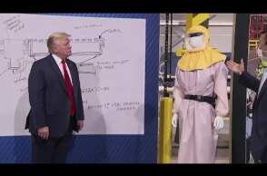 Trump visits Ford plant in Michigan, leaves mask off for cameras