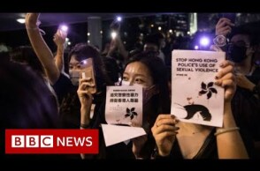 Hong Kong park lights up in sex abuse protest - BBC News