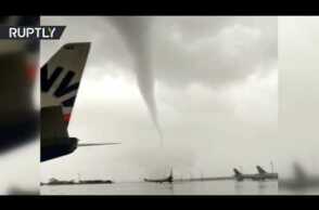 Damaged planes & toppled buses: Tornado wreaks havoc on Turkish airport