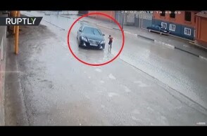 Dramatic video: Driver narrowly avoids hitting boy as he runs across road