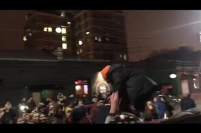 Moment Russian rapper Husky is arrested after impromptu gig on roof of car - video