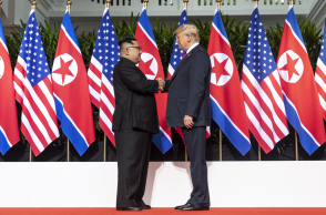 kim_and_trump_shaking_hands_at_the_red_carpet_during_the_dprk-usa_singapore_summit.jpg