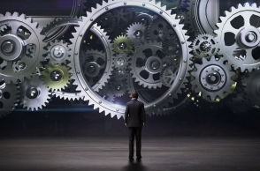 businessman-standing-big-gear-wheels-connecting-gear-wheels2_rcpcamkxx_thumbnail-full01.jpg