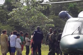 Στιγμιότυπο που δείχνει άτομα να διασώζονται από την Εθνική Υπηρεσία Αεροπορίας, στην κοινότητα Τερόν, στον Παναμά, μετά τις δολοφονίες. 