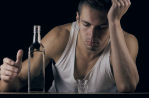 depressed-man-drinking-vodka-in-a-dark-room_bcs6hvp1l_thumbnail-full01.png
