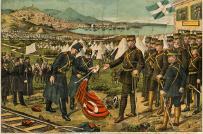 Επιχρωματισμένο χαρακτικό το οποίο αποδίδει τη στιγμή της παράδοσης της Θεσσαλονίκης από τον Ταχσίν Πασά στον Αρχιστράτηγο και Διάδοχο Κωνσταντίνο. Η παράδοση έγινε τις τελευταίες μέρες του Οκτωβρίου 1912, στο πλαίσιο του Α´ Βαλκανικού Πολέμου. Εικονίζονται πολλά σημαίνοντα πρόσωπα του στρατιωτικού βίου της χώρας. Από τις Συλλογές του Πολεμικού Μουσείου 