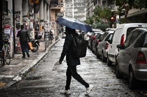 Άτομο με ομπρέλα