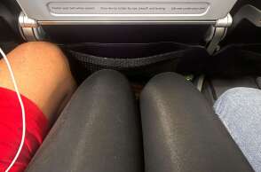 manspreading-on-plane-1-032726-e3fce996591a4ebdaae4b8beb69c5637