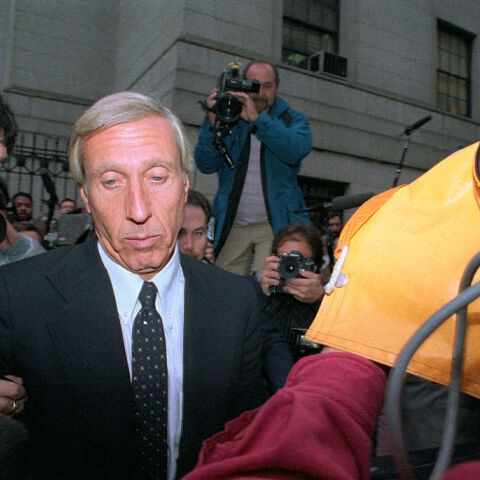 Members of the media surround corrupt financier Ivan Boesky and his attorney as they arrive at federal court in New York City, where he is to plead guilty to a criminal charge stemming from his insider trading. One of the richest men in the world, Boesky faces five years in prison.