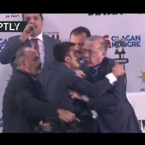 Erdo-hug: Fan rushes on stage to embrace Turkish president