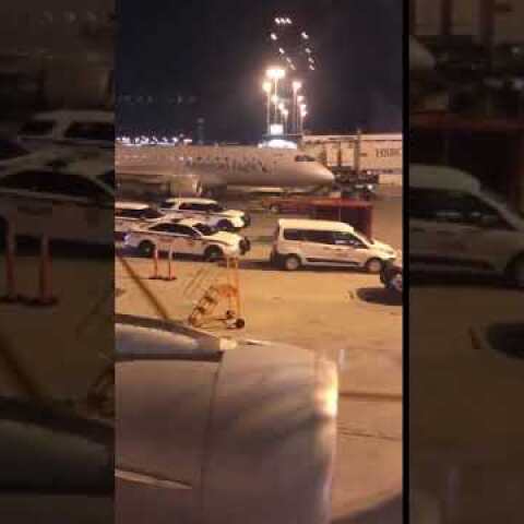 AMERICAN AIR FLIGHT EVACUATED AT MIAMI - BOMB THREAT (FOOTAGE)