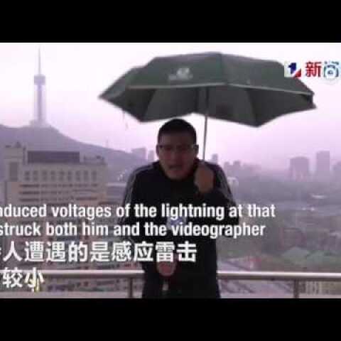 Chinese weather man hit by lightning bolt while holding an umbrella doing LIVE broadcast in a storm