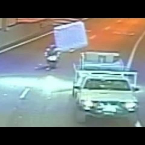Flying mattress hits motorcyclist