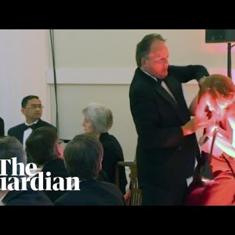 Conservative MP Mark Field grabs climate protester by the neck