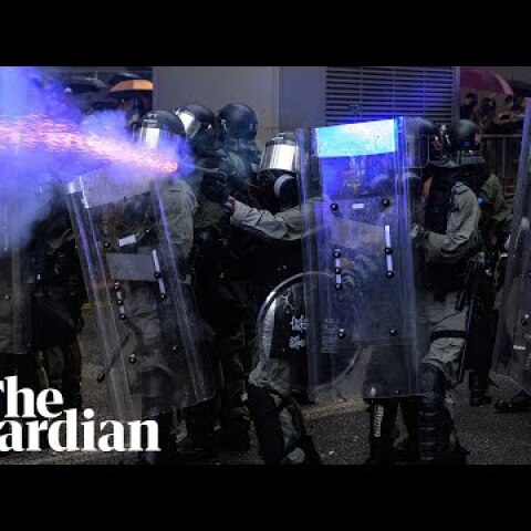 Police draw guns and deploy water cannon in clashes with Hong Kong protesters