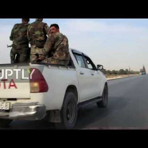 Syria: US troops and SAA cross paths on road between Manbij and Kobani *EXCLUSIVE*
