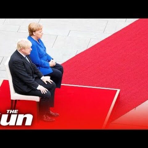 Boris Johnson given a military welcome in Germany by Angela Merkel