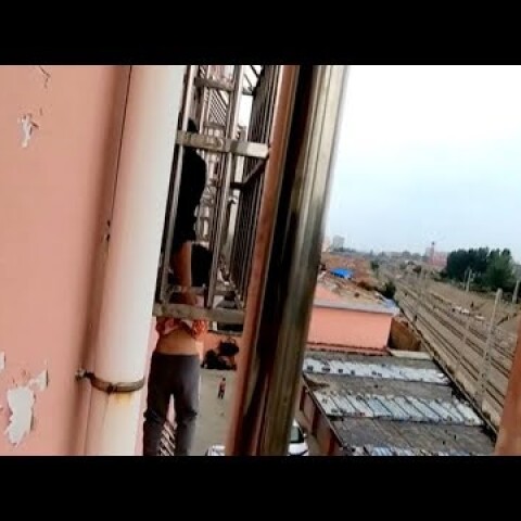 Firefighters rescue boy dangling from fourth floor window