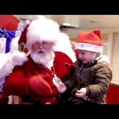 Santa signing to child