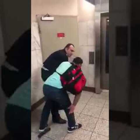 The Police State of Greece: Cop publicly abuses an immigrant selling umbrellas (Syntagma metro)