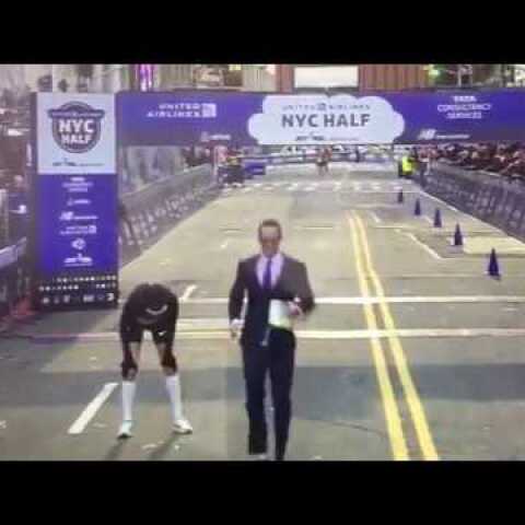 Chris Estwanik runs a half-marathon in a business suit