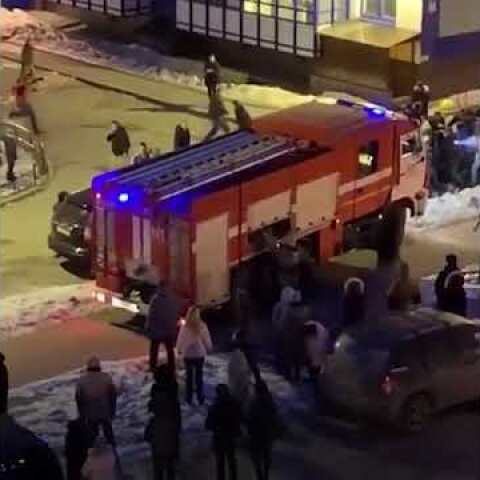 People drag cars out of the way of firetruck responding to emergency
