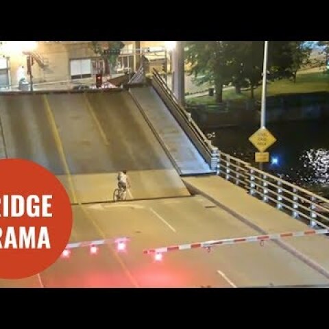 Cyclist ignores bridge warning barriers and falls into gap of drawbridge