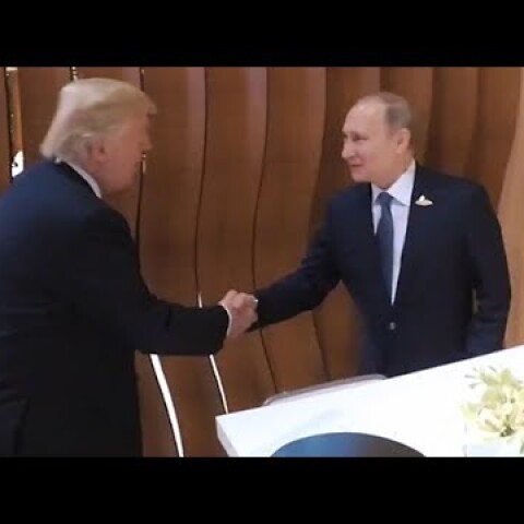 Donald Trump and Vladimir Putin shake hands for the first time