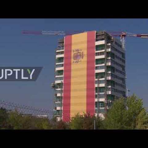 Spain: Gigantic Spanish flag covers entire building in Madrid