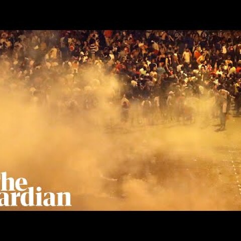 Police and football fans clash in Paris after France's World Cup victory