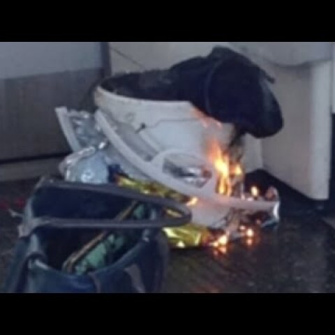Burning device filmed on tube carriage at Parsons Green station