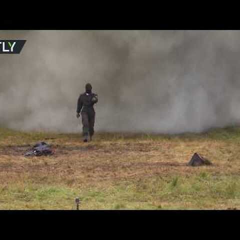 Russian Superwoman: Outrageous walk through explosions & fire to test armor suit
