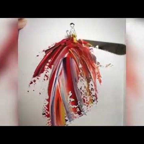 Artist uses paint and water drops to create spontaneous dress designs