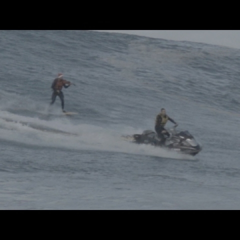 Musician Plays Violin While Surfing Waves