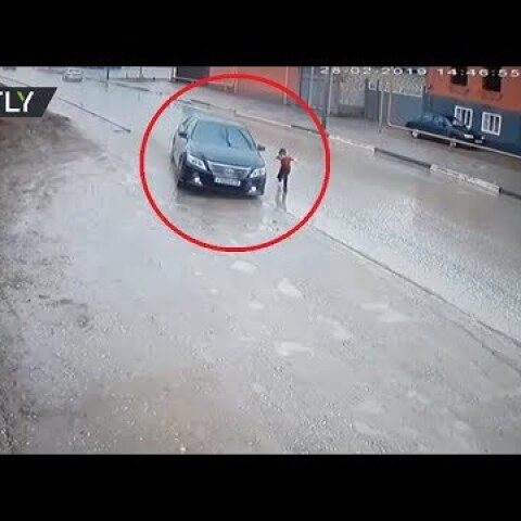 Dramatic video: Driver narrowly avoids hitting boy as he runs across road