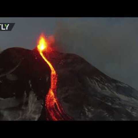 Eruption fly-over: Mount Etna spewing lava & smoke, captured from drone