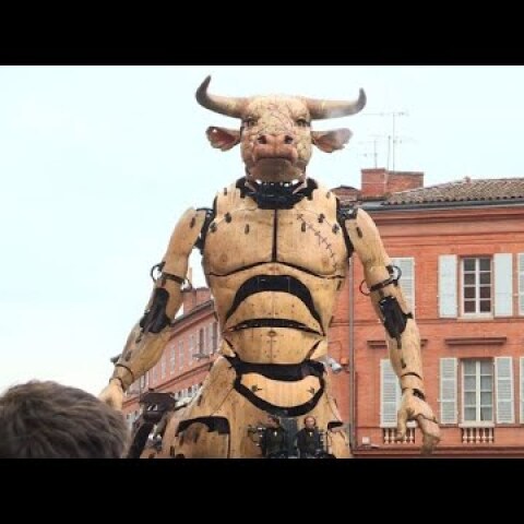 A minotaur and giant spider parade through Toulouse streets