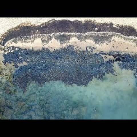 The environmental disaster from the oil accident in Salamis Greece from above. Drone footage.