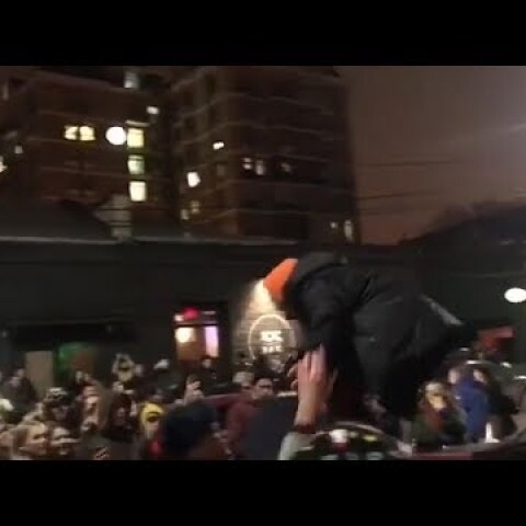 Moment Russian rapper Husky is arrested after impromptu gig on roof of car - video