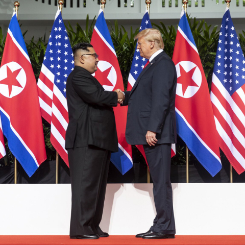 kim_and_trump_shaking_hands_at_the_red_carpet_during_the_dprk-usa_singapore_summit.jpg