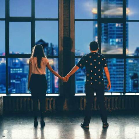 man and woman holding hands