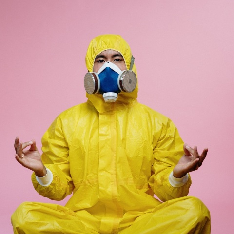 person-in-yellow-protective-suit-doing-a-yoga-pose-3951367.jpg