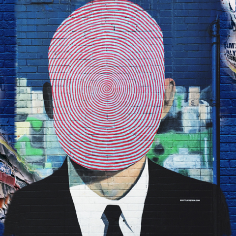 Γκράφιτι που απεικονίζει άνθρωπο με δακτυλικό αποτύπωμα αντί για κεφάλι