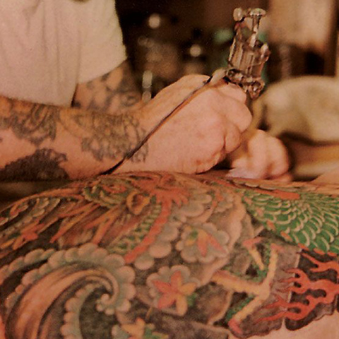 norman-collins-tattooing-back_0.jpg