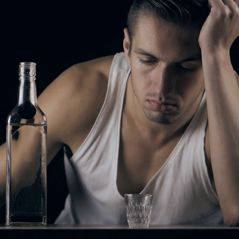 depressed-man-drinking-vodka-in-a-dark-room_bcs6hvp1l_thumbnail-full01.png