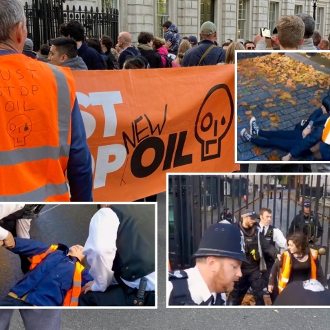 Ακτιβιστές της περιβαλλοντικής οργάνωσης Just Stop Oil επιχείρησαν να περάσουν από τις πύλες της Ντάουνινγκ Στριτ - Τους απομάκρυναν ένοπλοι αστυνομικοί.