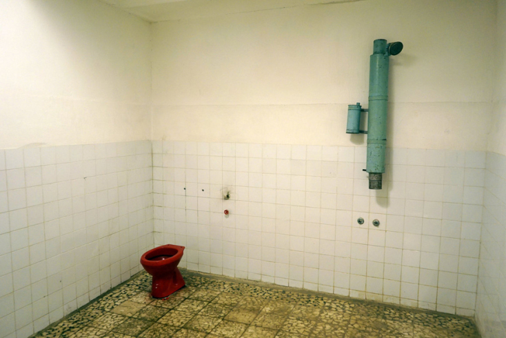 hoxha-private-bathroom-with-red-toilet-and-diesel-powered-shower.jpg