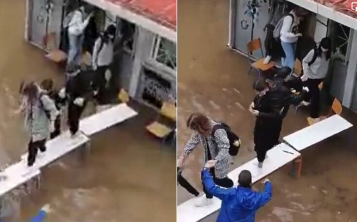 Νέα Φιλαδέλφεια: Μαθητές πάνω σε θρανία αποχωρούν από το πλημμυρισμένο σχολείο, περπατώντας σε θρανία